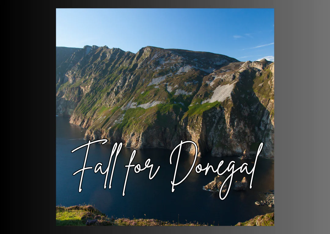 Scenic Donegal cliffs by the sea with vibrant green and blue hues, inviting guests to explore nature's beauty.